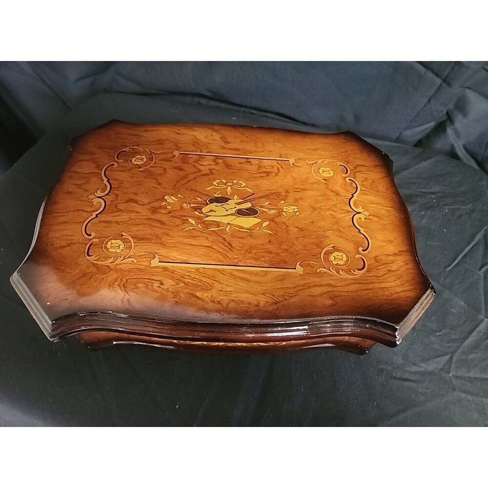 wooden jewelry box with violin pictured on top